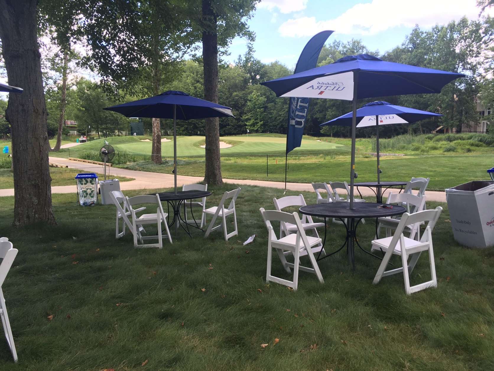 Along the par 3 3rd hole, the Michelob Ultra Grove provides an outdoor seating area with views of the green, also serving as a de facto end point for most spectators. You can keep going across the road to holes 4 and 5, but most won't. (WTOP/Noah Frank)