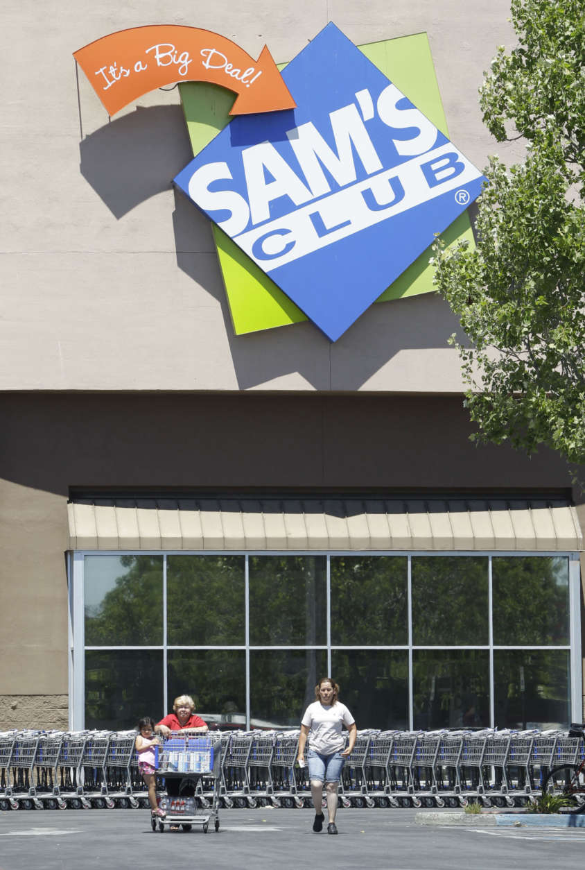 In this June 20, 2011 photo, shoppers leave a Sam's Club store, that is owned by Wal-Mart, in Concord, Calif. Retailers are reporting solid sales gains for July Thursday, Aug. 4, 2011, as deep discounts and sweltering heat drove shoppers to air conditioned malls. But with growing concerns about the economy, analysts worry shoppers heading back to malls for back-to-school shopping will hold tight to some of the habits of the Great Recession _ focusing on necessities and waiting for big discounts. (AP Photo/Paul Sakuma)