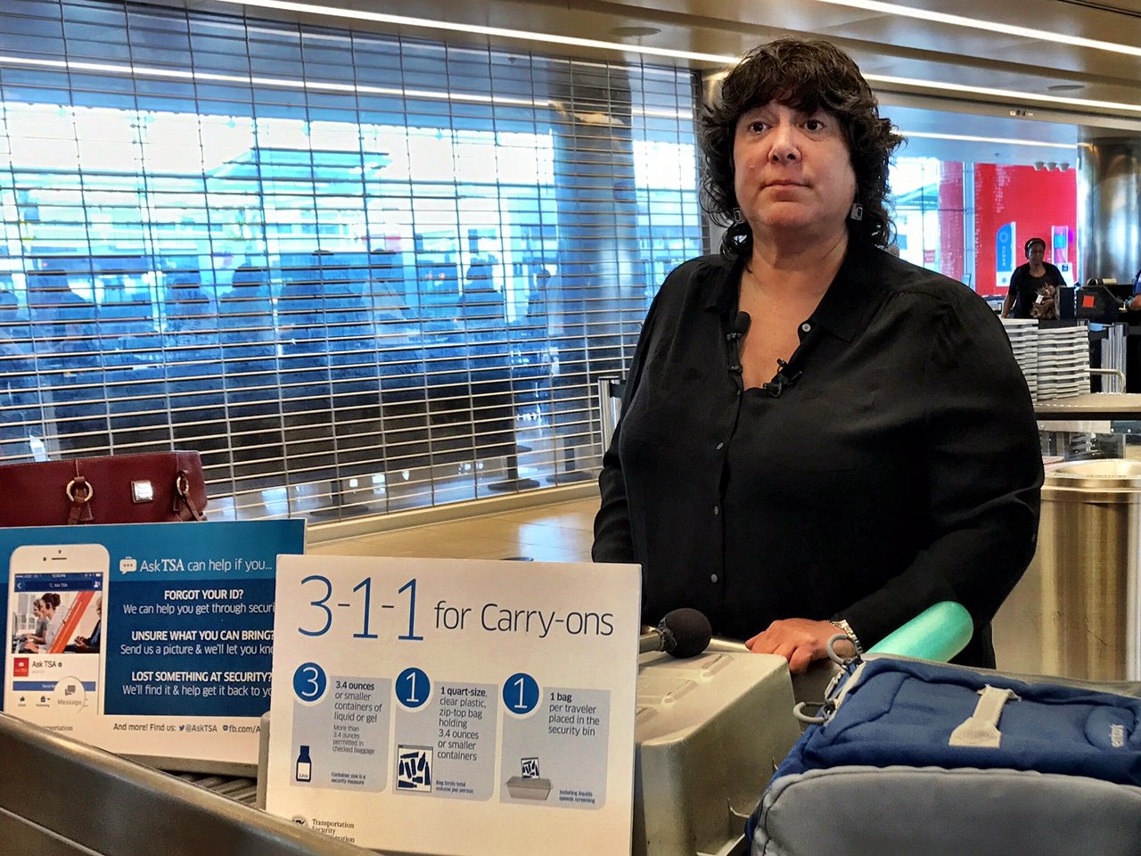 TSA spokesperson Lisa Farbstein said, "If you can spill it, spread it, spray it, pump it, or pour it it's probably a liquid, gel, or aerosol." Small portions, 3.4 ounces or less, can be carried aboard in a quart-sized bag. (WTOP/Neal Augenstein)