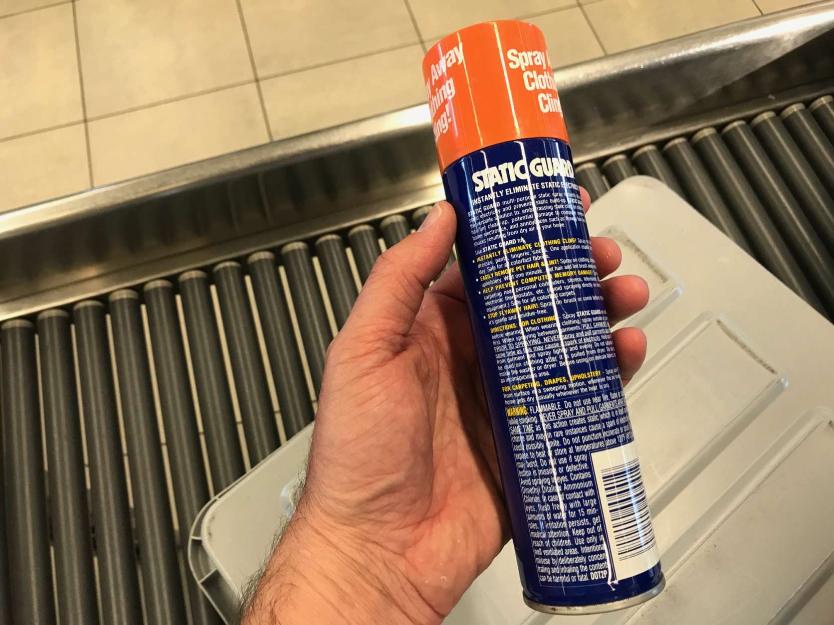 Any spray container that reads 'Flammable' is not allowed on the plane, in checked or carry-on luggage. (WTOP/Neal Augenstein)
