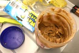 A jar of peanut butter must go in checked luggage, said the TSA's Lisa Farbstein, since it resembles a gel or paste. If the peanut butter is already on a sandwich, it can be carried on. (WTOP/Neal Augenstein)