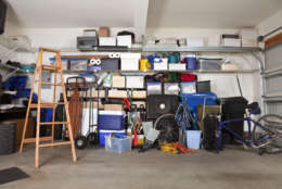 No one likes organizing their garage, but installing shelving can make finding things faster and easier. (Thinkstock)