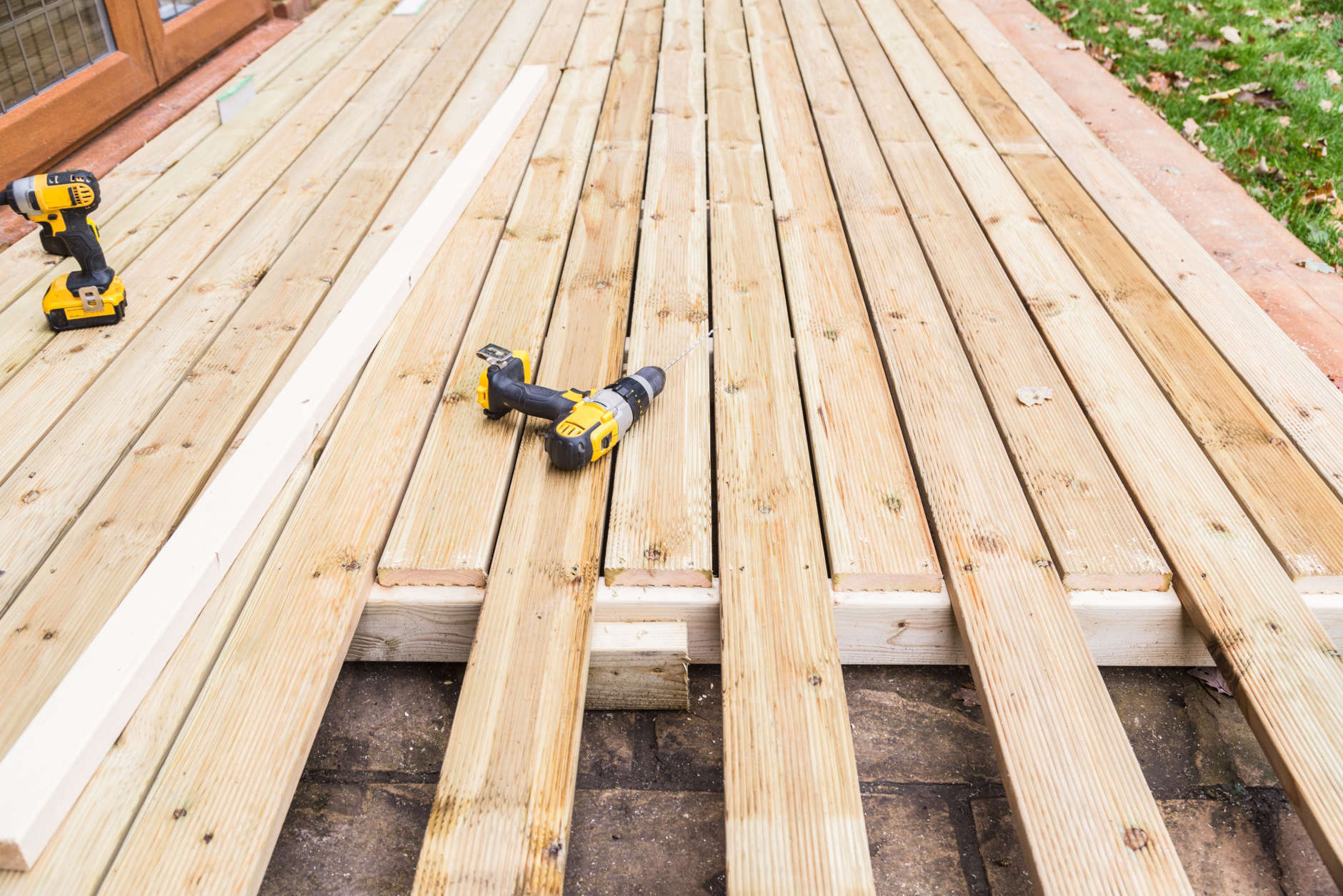 Old, pressure-treated wood in decks contains arsenic and poses a risk to people who touch it with bare feet or hands.  (Thinkstock)