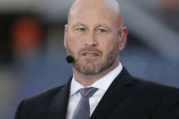 FILE - In this Sept. 19, 2016, file photo, Trent Dilfer talks during ESPN's "Monday Night Countdown" before an NFL football game between the Chicago Bears and the Philadelphia Eagles, in Chicago. ESPN is laying off about 100 employees, including former athletes-turned-broadcasters Trent Dilfer, Len Elmore and Danny Kanell, in a purge designed to focus the sports network on a more digital future. The cuts will trim ESPN's stable of on-air talent and writers by about 10 percent. (AP Photo/Charles Rex Arbogast, File)