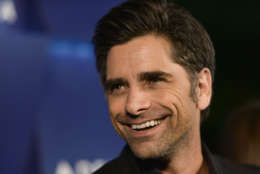 John Stamos arrives at the Delta Airlines' star-studded summer celebration on Thursday, Aug. 15, 2013 in Beverly Hills, Calif. (Photo by Richard Shotwell/Invision/AP)