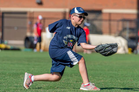 Wounded warriors coach softball to children with similar challenges