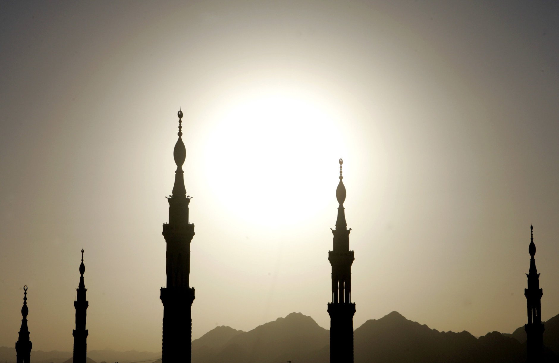 A view of the towers of the Prophet Mohammad's Mosque as the sunsets in Medina  in Saudi Arabia Wednesday Jan. 3, 2007. After taking part in the Hajj, Muslim pilgrims head to Medina to pray at the Prophet's mosque, Islam's second holiest place of worship, before returning home.(AP Photo/Khalil Hamra)