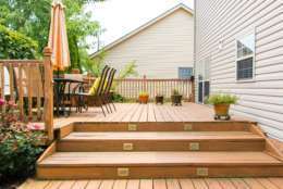 Adding shade to an outdoor seating area can make it more usable during the summer.