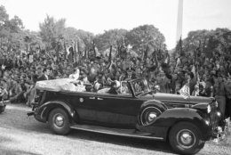 Throng of Boy Scouts cheered the King and Queen of England when the foreign royalty reviewed the scouts at the White House in Washington, D.C., on June 8, 1939. The king and queen are in back of car driving by the waving youths. (AP Photo)