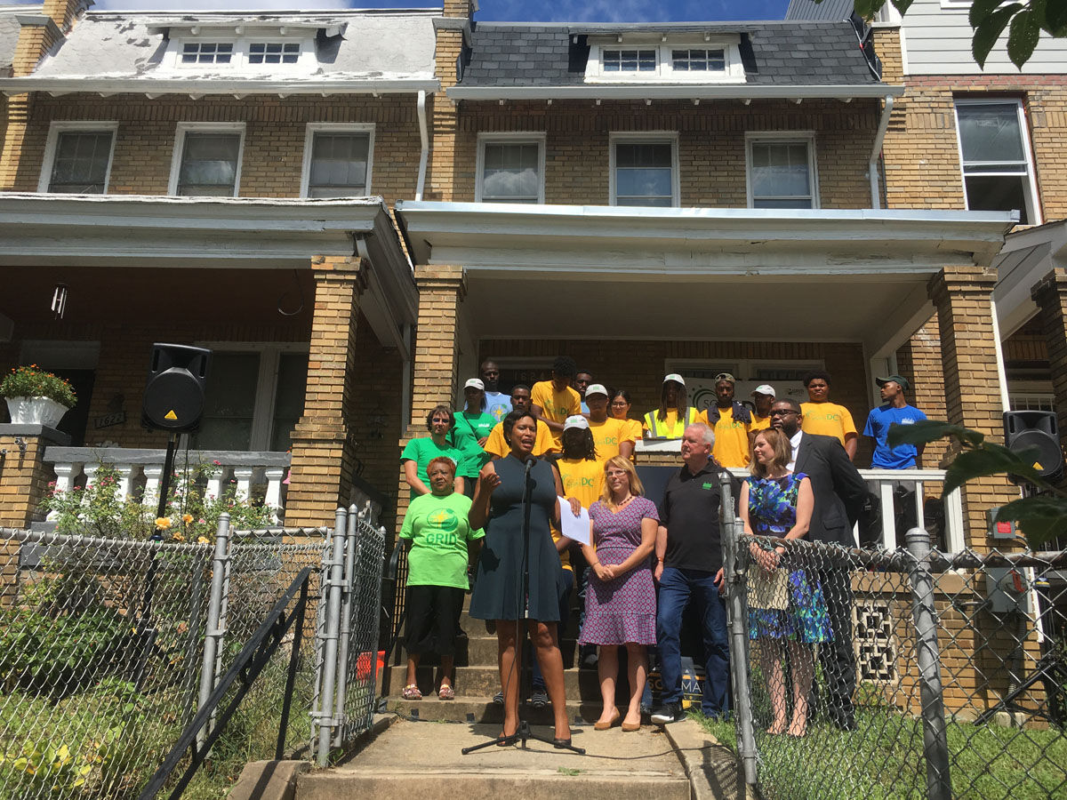 A new program touted by D.C. Mayor Muriel Bowser aims to install solar panels on nearly 300 homes of low-income D.C. families. Leaders say the panels will save the families nearly $600 a year in energy costs. (WTOP/Mike Murillo)