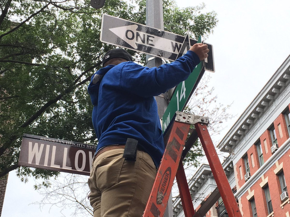 Twitter user Jason Rabinowitz captured crew members preparing the street for shooting, even snapping a picture of one member of the crew hanging a green D.C. street sign up at the corner. (Courtesy Jason Rabinowitz)