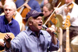 Art Garfunkel rehearses for the opening night concert with the Boston Pops Orchestra at Symphony Hall in Boston, Tuesday, May 11, 2004. Keith Lockhart starts his 10th season as conductor of the Boston Pops on Tuesday night with an assist by Garfunkel at the concert.(AP Photo/ Robert E. Klein)