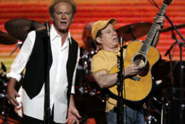 Art Garfunkel, left, and Paul Simon perform during the "From the Big Apple to the Big Easy" benefit concert, Tuesday, Sept. 20, 2005, in New York's Madison Square Garden. Proceeds from the concert will be donated to Hurricane Katrina relief.  (AP Photo/Jeff Christensen)