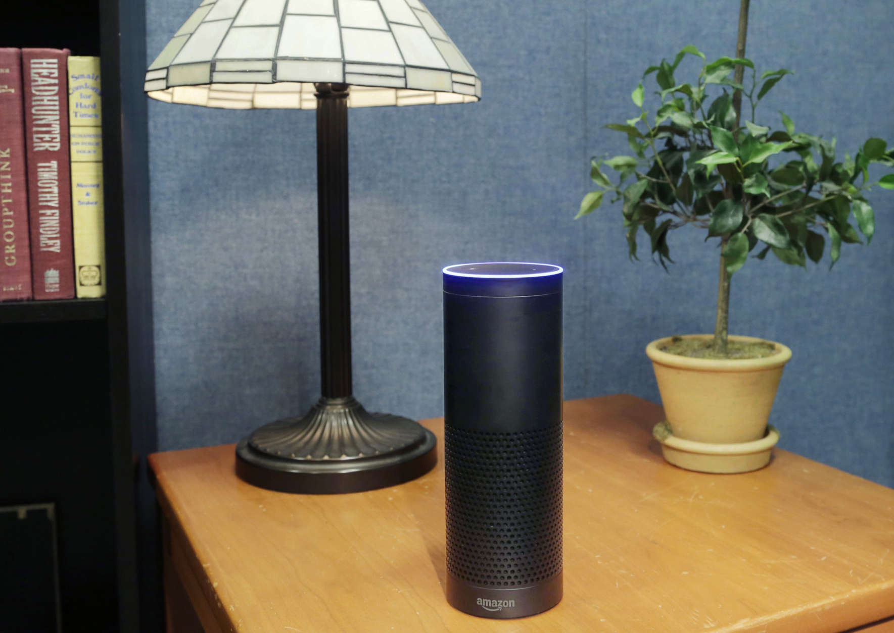 This July 29, 2015, file photo made in New York shows Amazon's Echo, a digital assistant that continually listens for commands such as for a song, a sports score or the weather. Starting Thursday, March 17, 2016, Amazons voice assistant will tell you how well you slept and how much more exercise you need, at least if you have a Fitbit fitness tracker and an Alexa-compatible device, such as Amazons Echo speaker and Fire TV streaming devices. (AP Photo/Mark Lennihan, File)