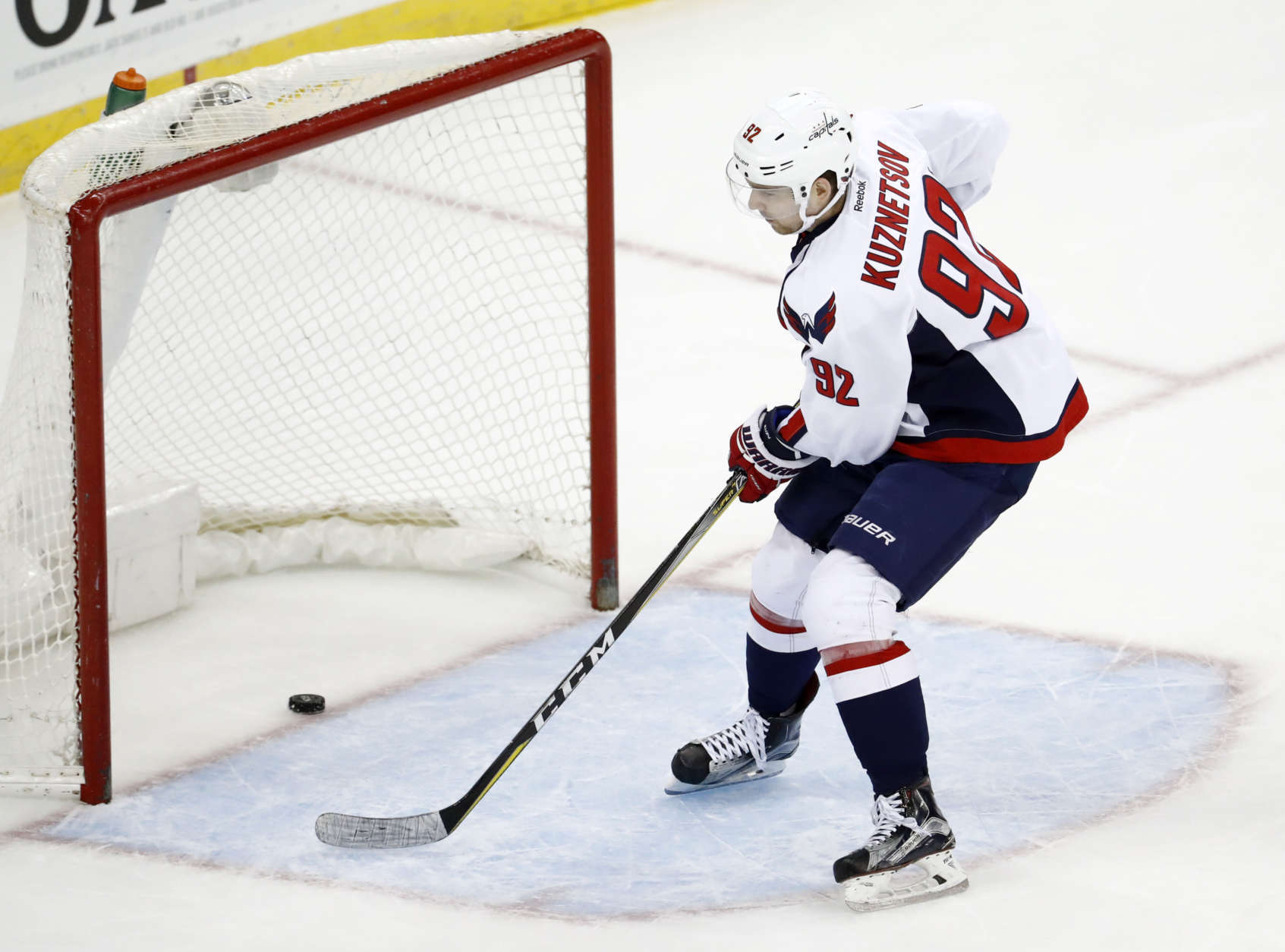 Washington Capitals center Evgeny Kuznetsov, of Russia, scores on an open net during the third period of an NHL hockey game against the New Jersey Devils, Thursday, Jan. 26, 2017, in Newark, N.J. The Capitals won 5-2. (AP Photo/Julio Cortez)