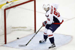 Washington Capitals center Evgeny Kuznetsov, of Russia, scores on an open net during the third period of an NHL hockey game against the New Jersey Devils, Thursday, Jan. 26, 2017, in Newark, N.J. The Capitals won 5-2. (AP Photo/Julio Cortez)