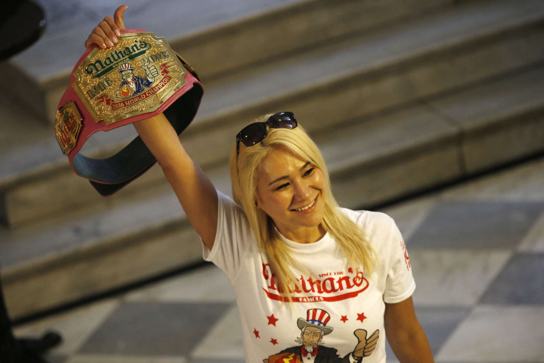 Miki Sudo, Las Vegas the woman hot dog-eating champion is introduced before taking part in the weight in for the Nathan's Famous Hotdog eating contest Monday, July 3, 2017, in Brooklyn, New York. Sudo is defending her title where she ate 38.5 hot dogs and buns in 10 minutes in 2016. (AP Photo/Michael Noble)