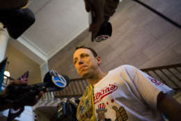 The current world hot dog eating champion, Joey Chestnut speaks to media after the Nathan's Famous Hotdog eating contest weight in on Monday, July 3, 2017, in Brooklyn, New York. Chestnut weight in at 220.5 and will be defending his title from Matt Stonie who has defeat Chestnut in the past. (AP Photo/Michael Noble)