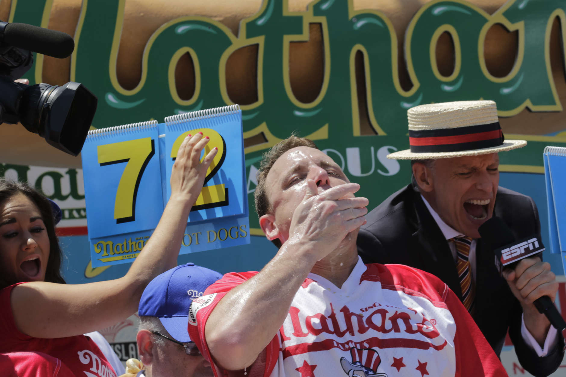 Joey Chestnut eats two hot dogs at a time during the Nathan's Annual Famous International Hot Dog Eating Contest, Tuesday July 4, 2017, in New York. Chestnut won, marking his 10th victory in the event. (AP Photo/Bebeto Matthews)
