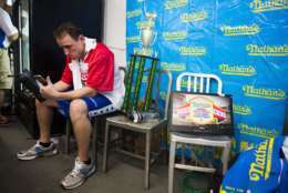 Joey Chestnut gets in the zone before the Nathan's Famous Hotdog eating contest Tuesday, July 4, 2017, in Brooklyn, New York. Chestnut ate 72 hotdogs in 10 minutes to claim his 10th win. (AP Photo/Michael Noble Jr.)
