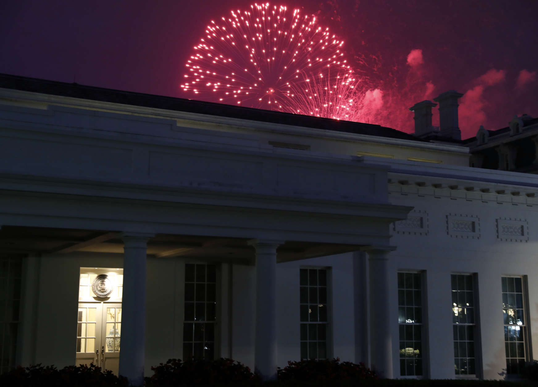 Fireworks explode over the West Wing of the White House for the Fourth of July holiday, Tuesday, July 4, 2017, in Washington. (AP Photo/Alex Brandon)