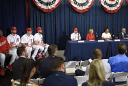 From right to left, Rob Manfred, Commissioner of Baseball, Muriel Bowser, Mayor of the District of Columbia; Marla Lerner Tanenbaum, Washington Nationals' Ryan Zimmerman, Bryce Harper, Max Scherzer, Daniel Murphy, and manager Dusty Baker during a baseball press conference to unveil the 2018 MLB All-Star Game logo, Wednesday, July 26, 2017, in Washington. (AP Photo/Nick Wass)