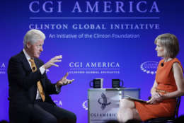 Former U.S. President Bill Clinton speaks during a televised conversation hosted by Bloomberg TV's Willow Bay, right, titled "A New Competitive Era: America in the World," on the final day of the annual gathering of the Clinton Global Initiative America, at the Sheraton Downtown, in Denver, Wednesday, June 25, 2014. (AP Photo/Brennan Linsley)