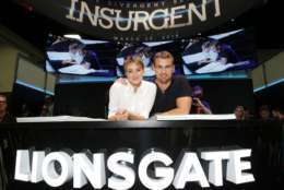 Shailene Woodley and Theo James seen at Summit Entertainment's "Divergent" Talent Signing at 2014 Comic-Con on Saturday, July 26, 2014, in San Diego, CA. (Photo by Eric Charbonneau/Invision for Lionsgate/AP Images)