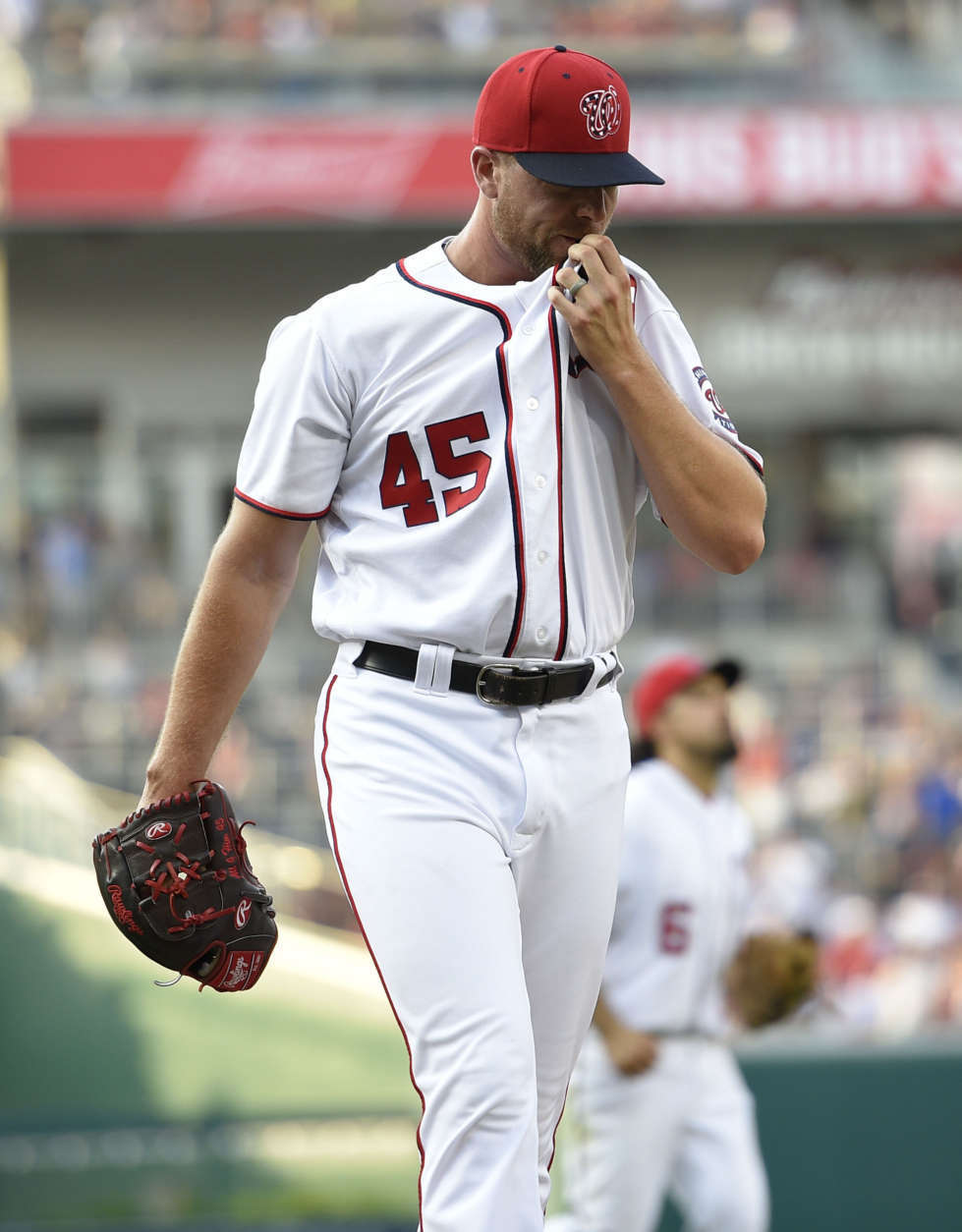 Washington Nationals relief pitcher Blake Treinen walks to the dugout after the top of the ninth inning of the team's baseball game against the Chicago Cubs, Thursday, June 29, 2017, in Washington. The Cubs won 5-4. (AP Photo/Nick Wass)