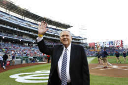 Former Washington Senators broadcaster Bob Wolff died at age 96. He was the first TV broadcaster for the Washington Senators. In this photo he waves to the crowd during a pre-game ceremony to honor him, before a baseball game between the Washington Nationals and the Cincinnati Reds at Nationals Park Friday, April 26, 2013, in Washington. (AP Photo/Alex Brandon)
