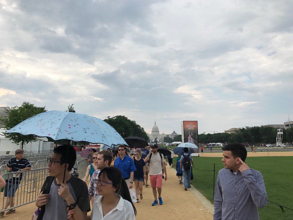 The umbrellas were out along the National Mall Tuesday for the Smithsonian Folklife Festival. (WTOP/Dick Uliano)