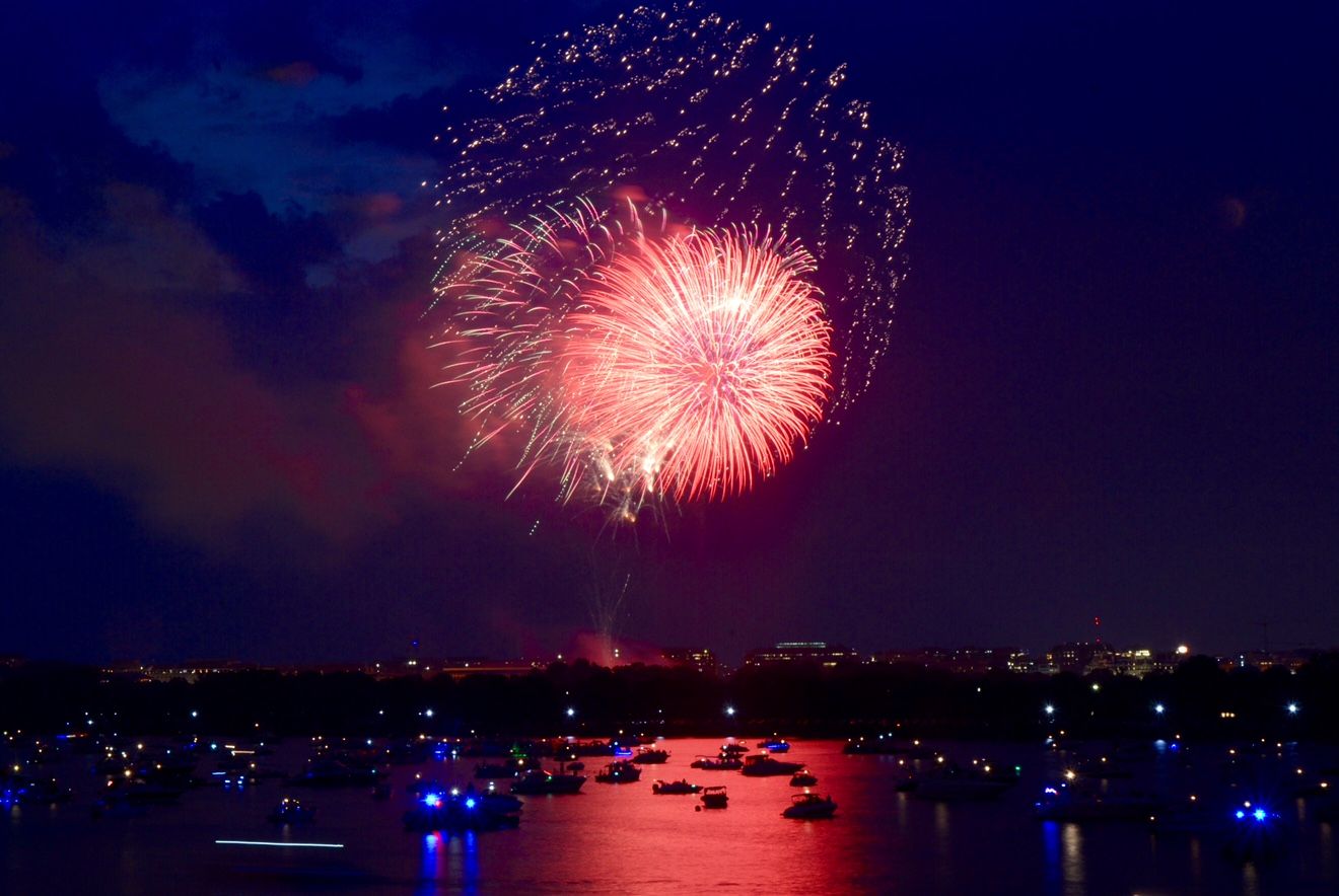 The July 4 fireworks over the National Mall, as seen from the 14th Street Bridge. (WTOP/Dave Dildine)