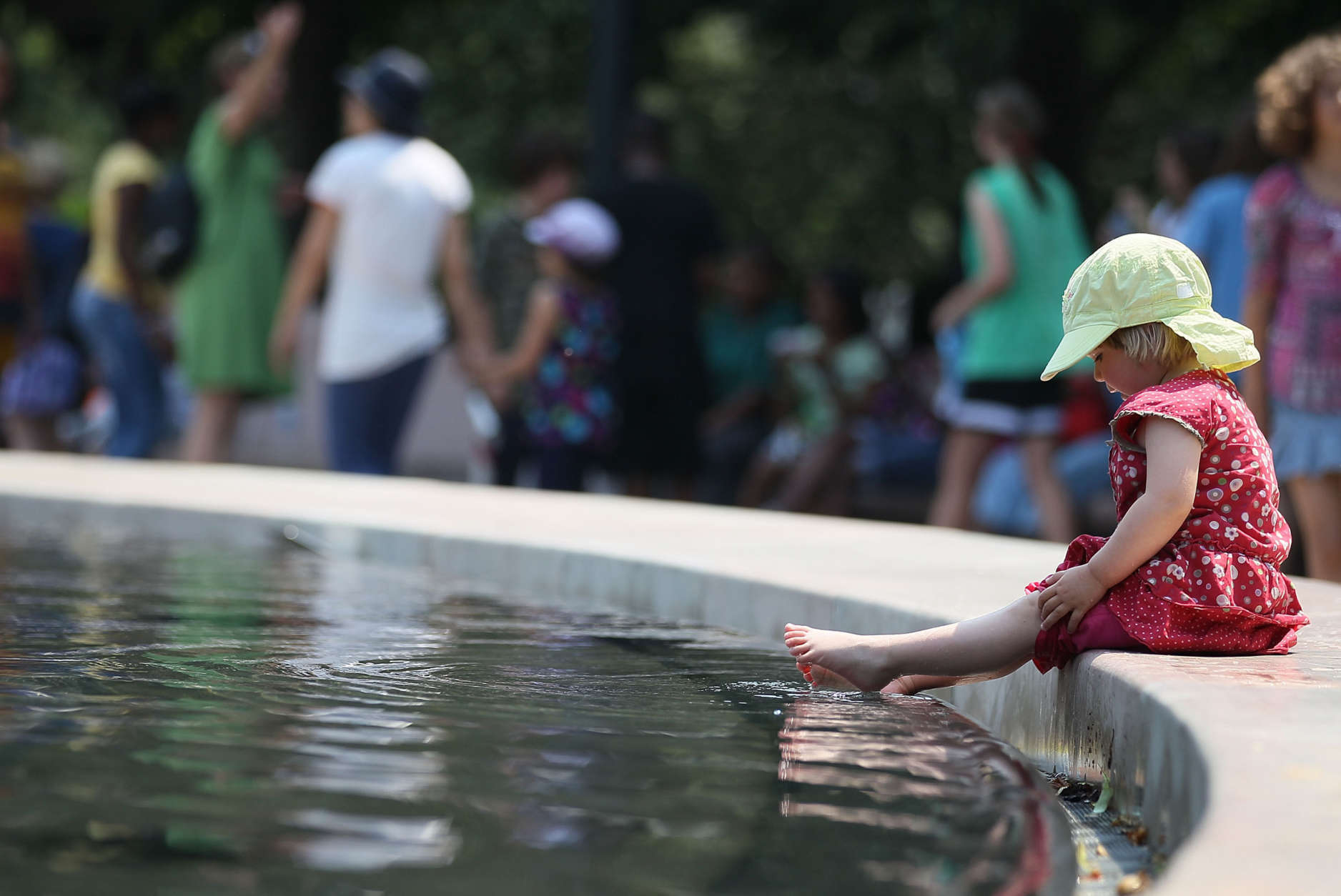 WASHINGTON, DC - JUNE 09:  Ronja Lerche, 2, of Erfurt, Germany, puts her feet in the fountain at the National Gallery of Art Sculpture Garden, on June 9, 2011 in Washington, DC. A heat advisory is in effect for the Washington area, and temperatures are expected to be in the middle to upper 90s this afternoon.  (Photo by Mark Wilson/Getty Images)