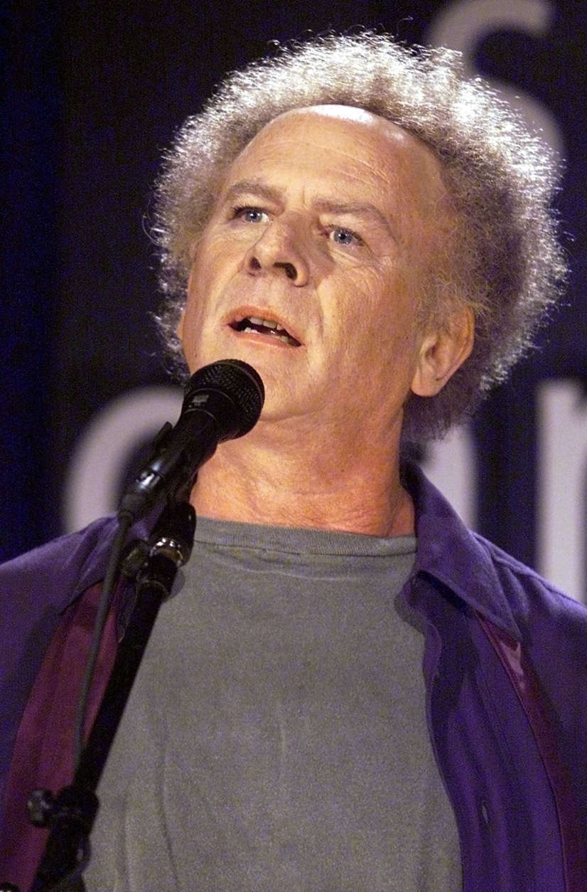 NEW YORK - SEPTEMBER 9:  Art Garfunkel performs with Paul Simon during a press conference announcing their reunion for a concert tour at the Bottom Line club September 9, 2003 in New York City.  (Photo by Adam Rountree/Getty Images)