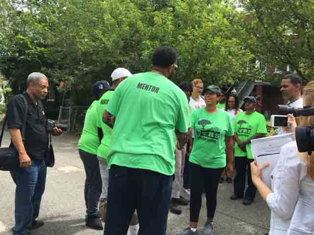 D.C. Mayor Muriel Bowser greets Grass is Greener mentors on Saturday. (WTOP/Jenny Glick) 