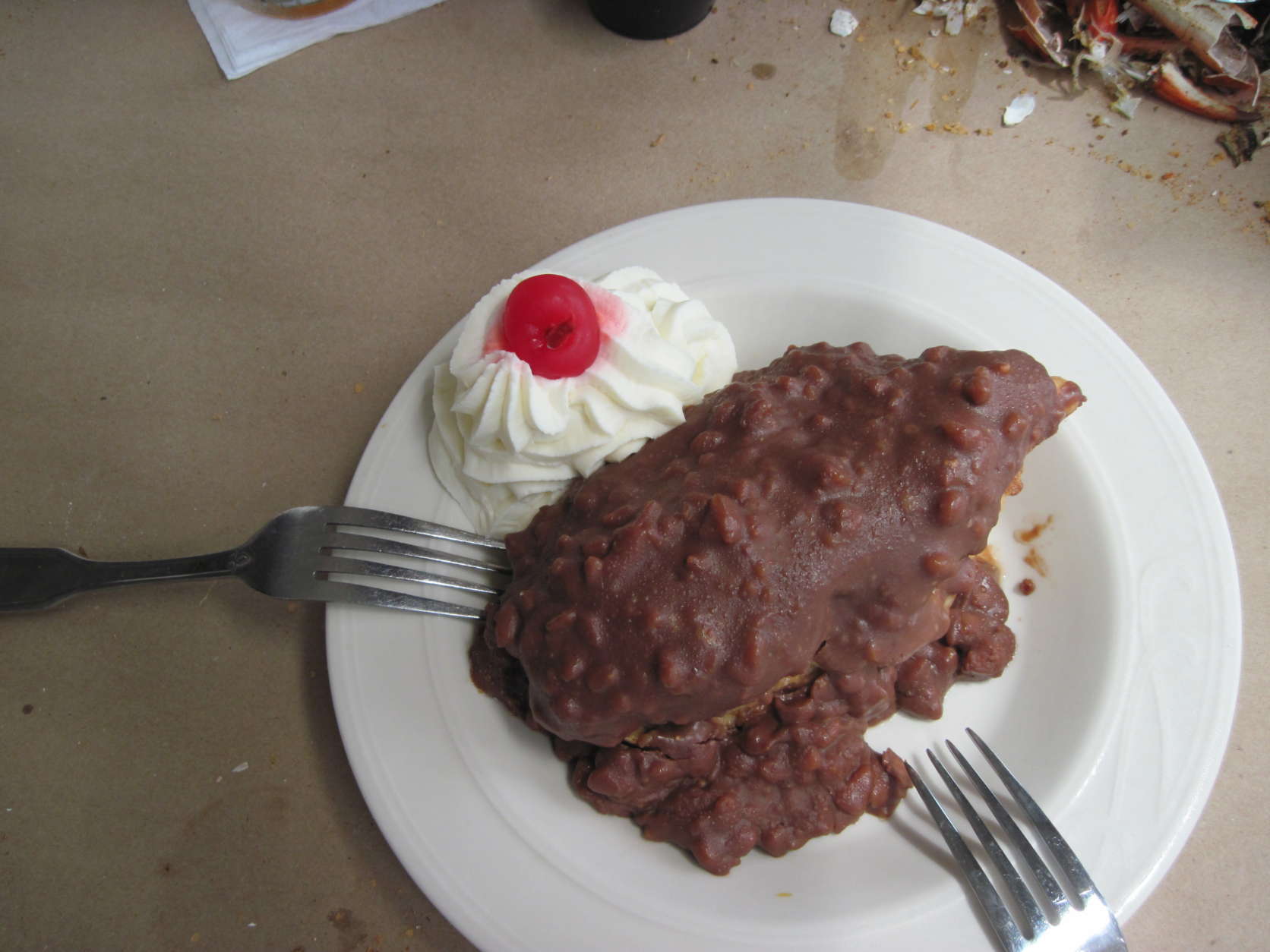 Save room for Suicide Bridge Restaurant's large, homemade chocolate éclair covered in frozen Heath Bar chocolate. This huge, creamy dessert came with whipped cream and a cherry on the side. (WTOP/Colleen Kelleher)