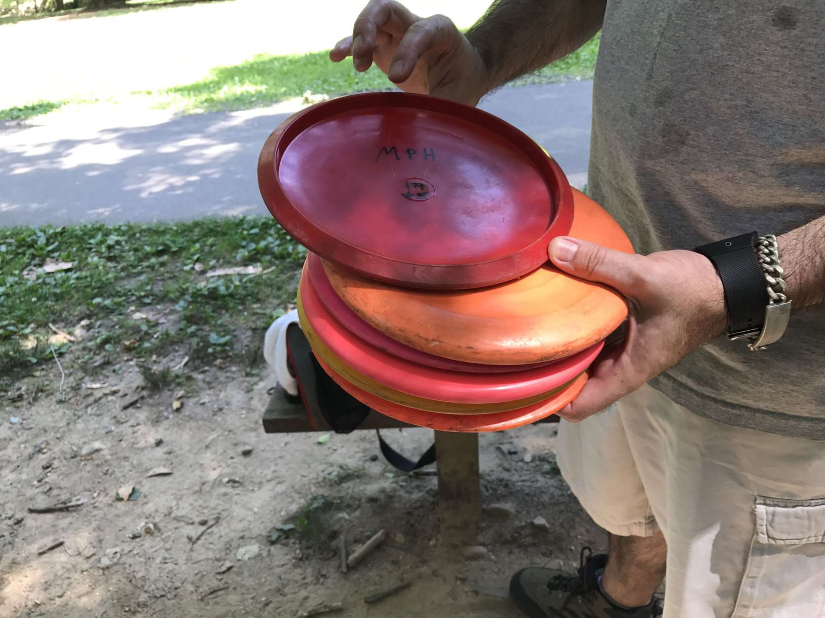 WTOP's J. Brooks shows off different types of discs that you can use for the sport. (WTOP/Ginger Whitaker)