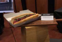 One of the new items on this year's concessions menu is the Japanese-inspired Hottodoggu, which is a beef hotdog topped with pickled cabbage, wasabi crema, nori, cilantro, scallions and sesame seeds. (WTOP/Ginger Whitaker)