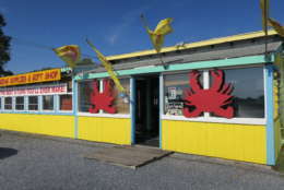 photo shows a bright yellow business that sells crabs