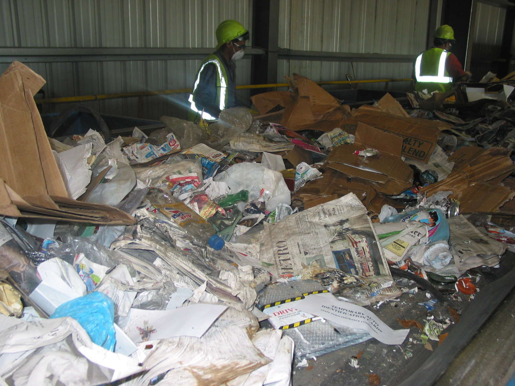 Workers at Prince George’s County Materials Recycling Facility in Capitol Heights, Maryland, sort through the items collected through single-stream recycling. (Courtesy Prince George's County)