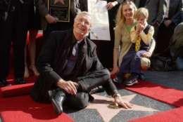 Actor Martin Landau, left, poses for photographers on his star on the Hollywood Walk of Fame, Monday, Dec. 17, 2001, in Los Angeles. Landau, who was honored with the 2,187th star on the wold famous walk, has had an acting career spanning more than four decades in nearly 90 films. Pictured to Landau's right are friend Gretchen Becker and Landau's godson Dylan Becker. (AP Photo/Rene Macura)