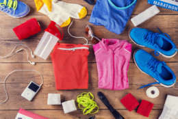 Various running stuff laid on a wooden floor background