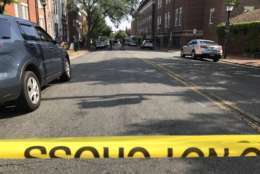 Photo shows crime scene tape over an Alexandria street