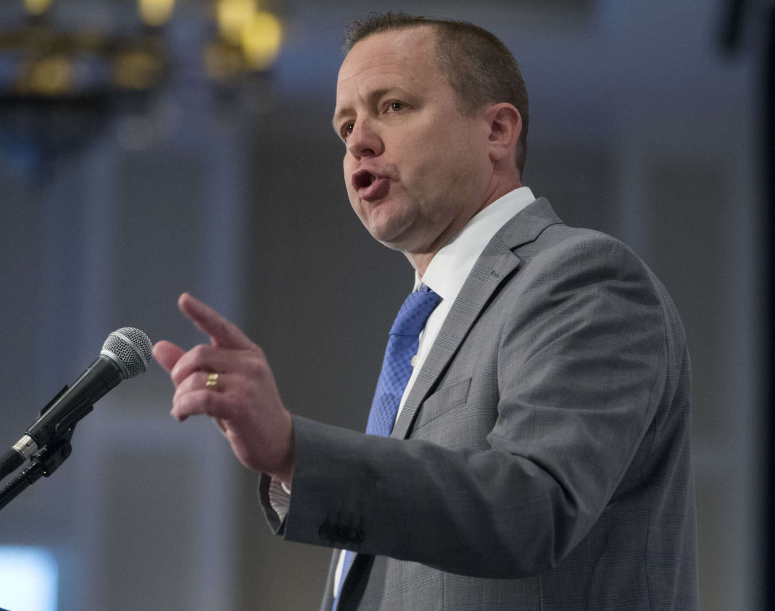 Republican candidate for Governor of Virginia, Corey Stewart, gestures as he speaks at the Virginia Chamber of Commerce Economic Summit at Colonial Williamsburg in Williamsburg, Va., Friday, Dec. 2, 2016. (AP Photo/Steve Helber)