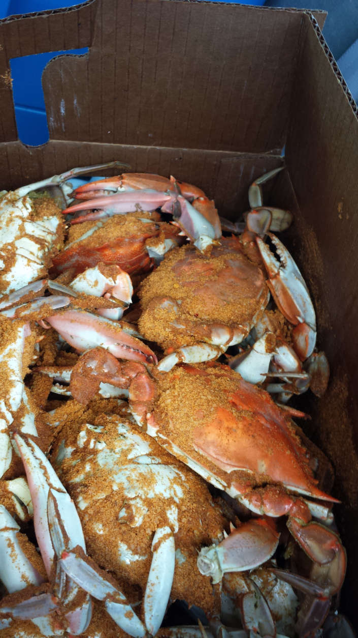 Photo shows a half-bushel of crabs