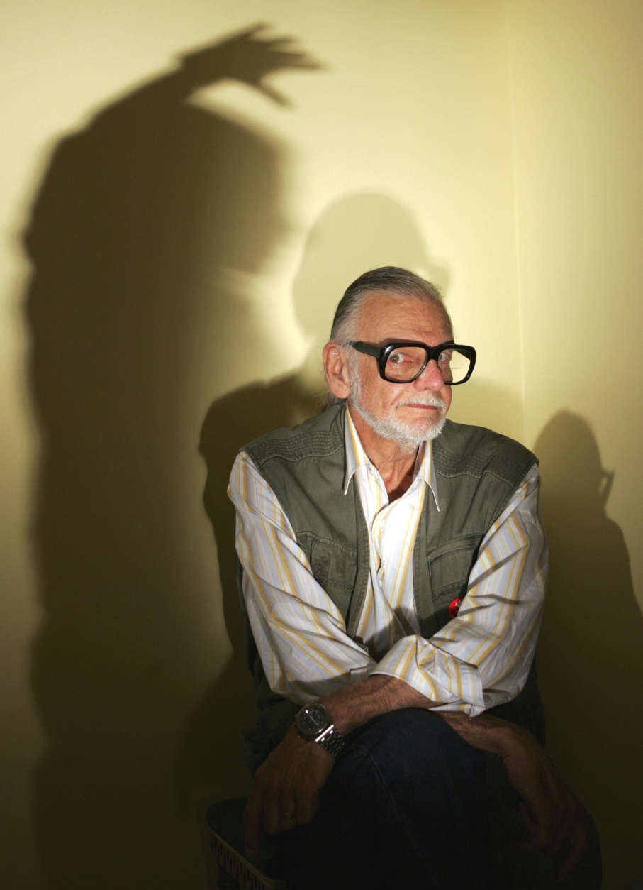 Zombie-movie master George Romero, director of "Night of the Living Dead," "Dawn of the Dead," Day of the Dead," and his latest film "Land of the Dead," poses with shadows June 16, 2005, in Beverly Hills, Calif. (AP Photo/Chris Carlson)
