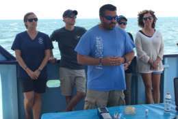 Mike Hyatt, chief scientist of OCEARCH, leads a science brief, where scientists spoke about their projects aboard the OCEARCH. (WTOP/Michelle Basch)