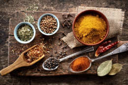 various spices on old wooden table