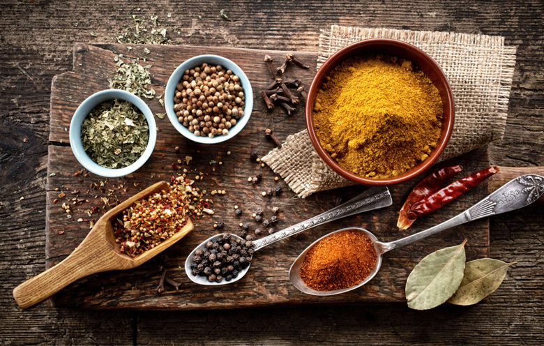 various spices on old wooden table