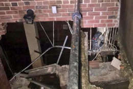 A wall in an apartment building buckled under heavy rains, leaving 11 people without a home. (Courtesy D.C. Fire and EMS)